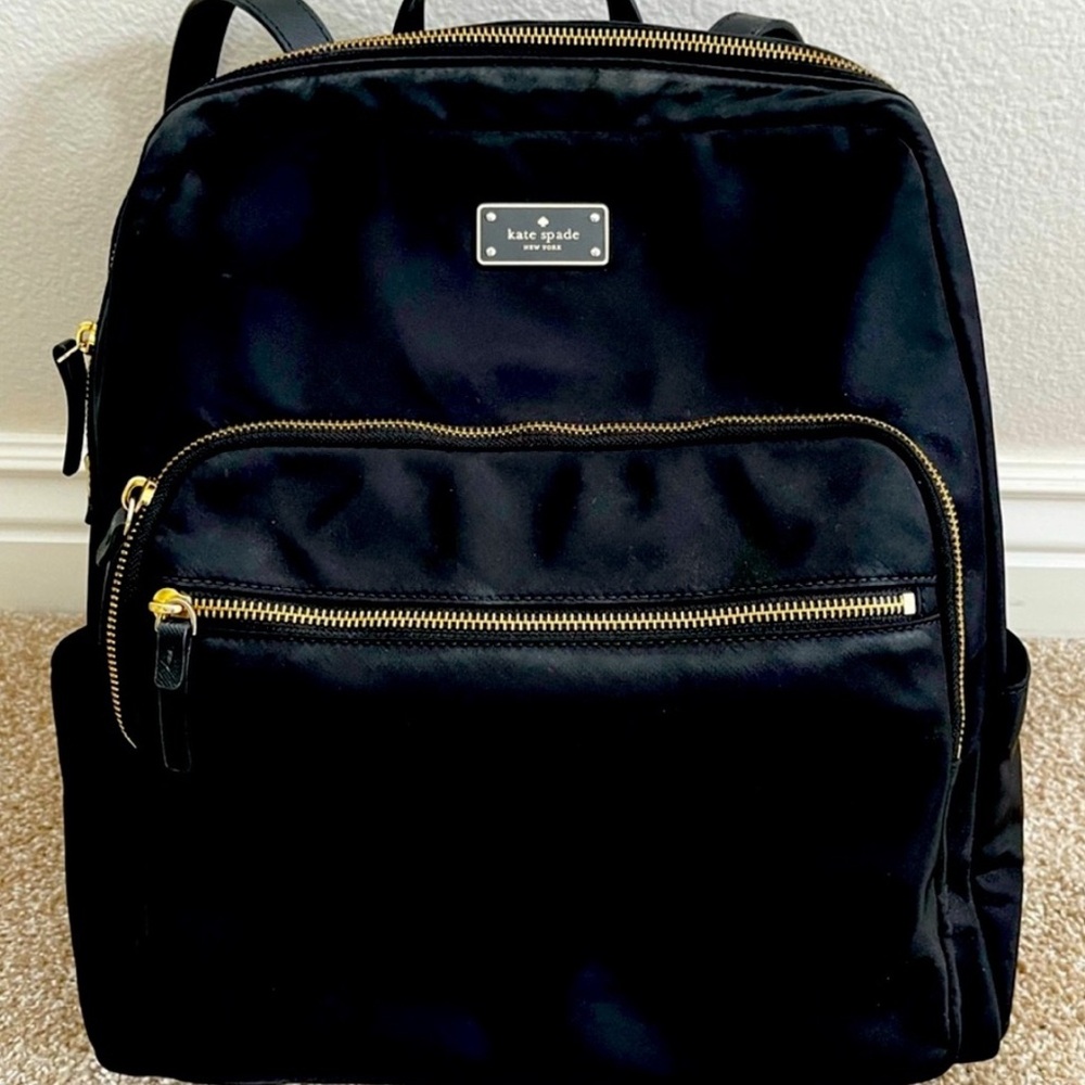 Kate Spade Elegant Black Backpack with Gold Accents